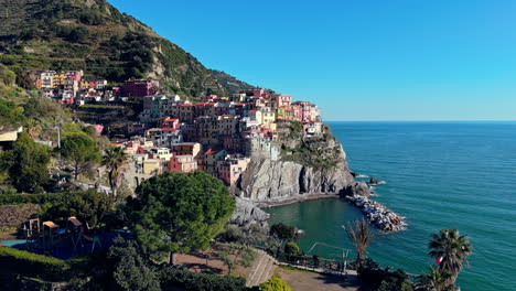 colorful manarola coastal village in cinque terre, shot from above, sunny day