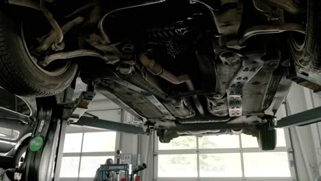 car undercarriage inspection in a garage