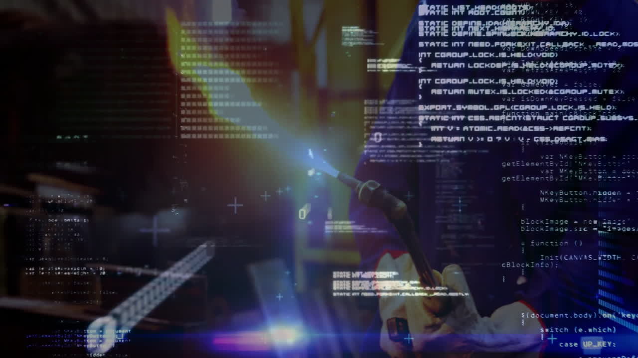 male technician operating blowtorch with blue flame in factory bay displaying floating code overlay