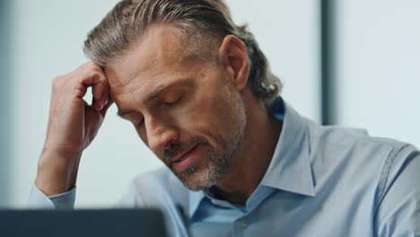Upset ceo looking laptop office portrait. Stressed businessman reading bad news