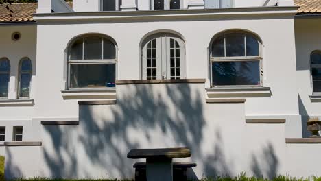 4k 60fps beautil 19th century house in sweden with apartment building in scandinavian design in the background - tilt shot