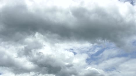 time lapse of white fluffy clouds in the blue sky background