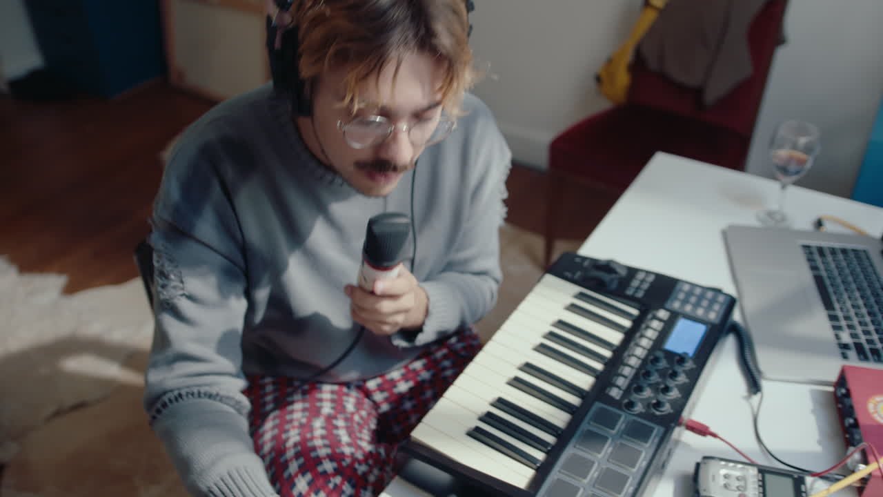 Musician Singing in Mic and Recording Song in Home Studio