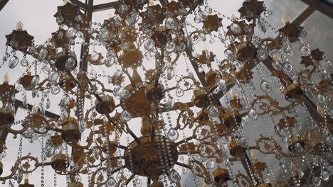 Vintage luster decorated with crystals and golden carcass