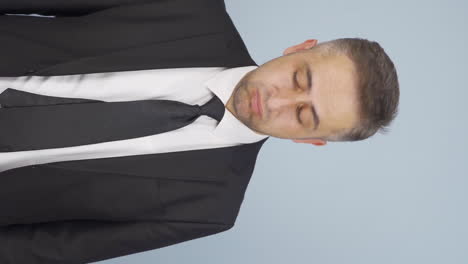 Vertical-video-of-Bored-businessman-sighs.