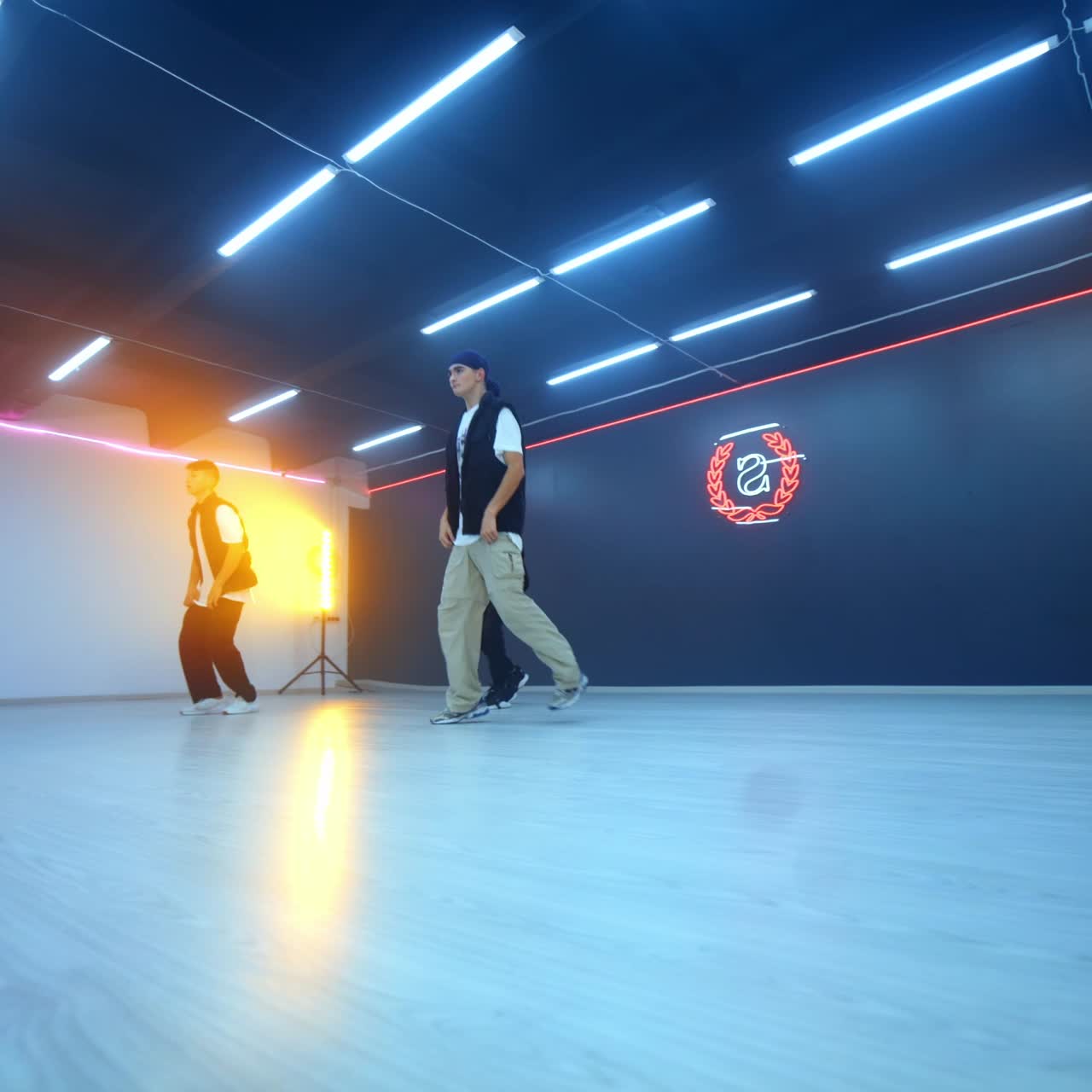 Modern dance style performed by male hop hoppers. Three guys dancing in studio