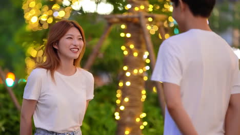 happy man and woman love couple together eating dessert and chatting talking enjoying breakfast in cozy cafe outdoors in winter