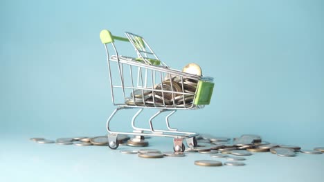 shopping cart filled with coins