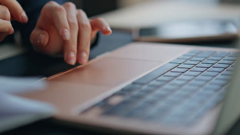 closeup businesswoman fingers swiping touchpad in office. executive scrolling