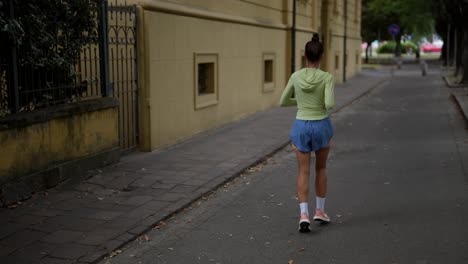 woman running on city street