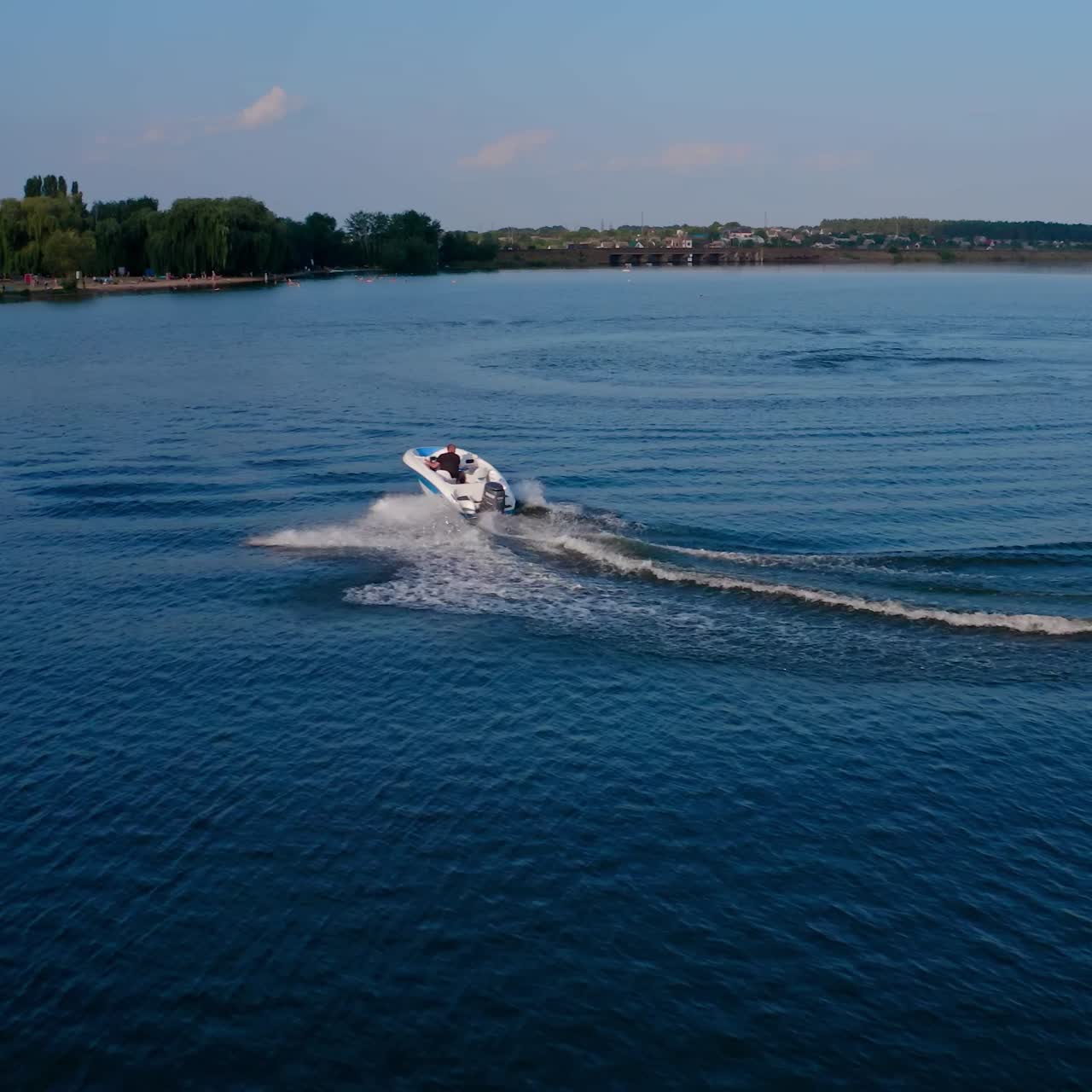 Speed boat sailing along river