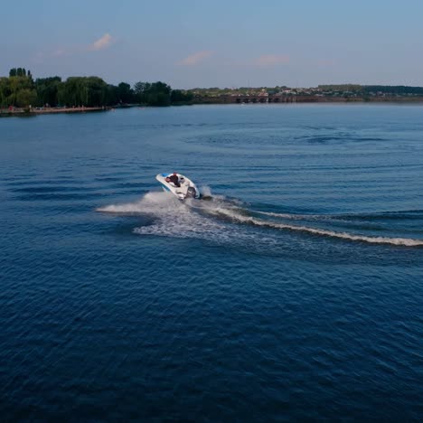 speed boat sailing along river