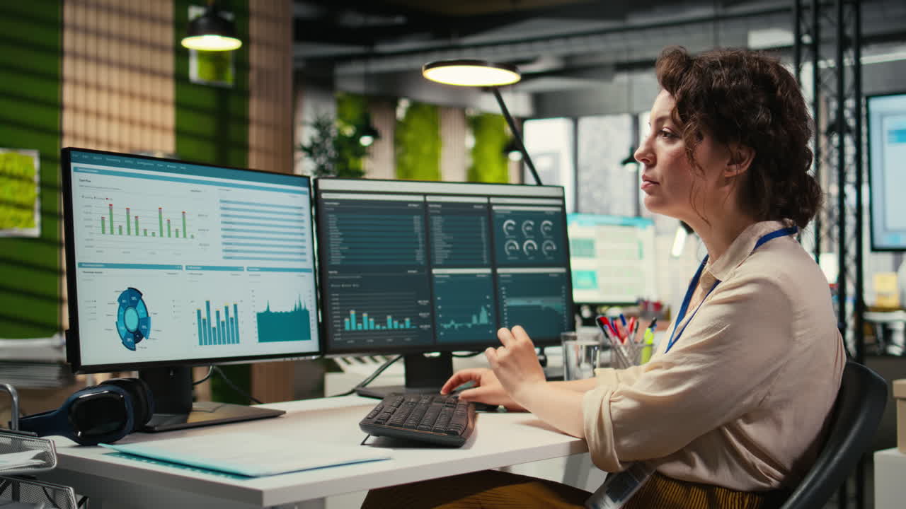 Vertical Video Administrator engages with financial data insights on a computer