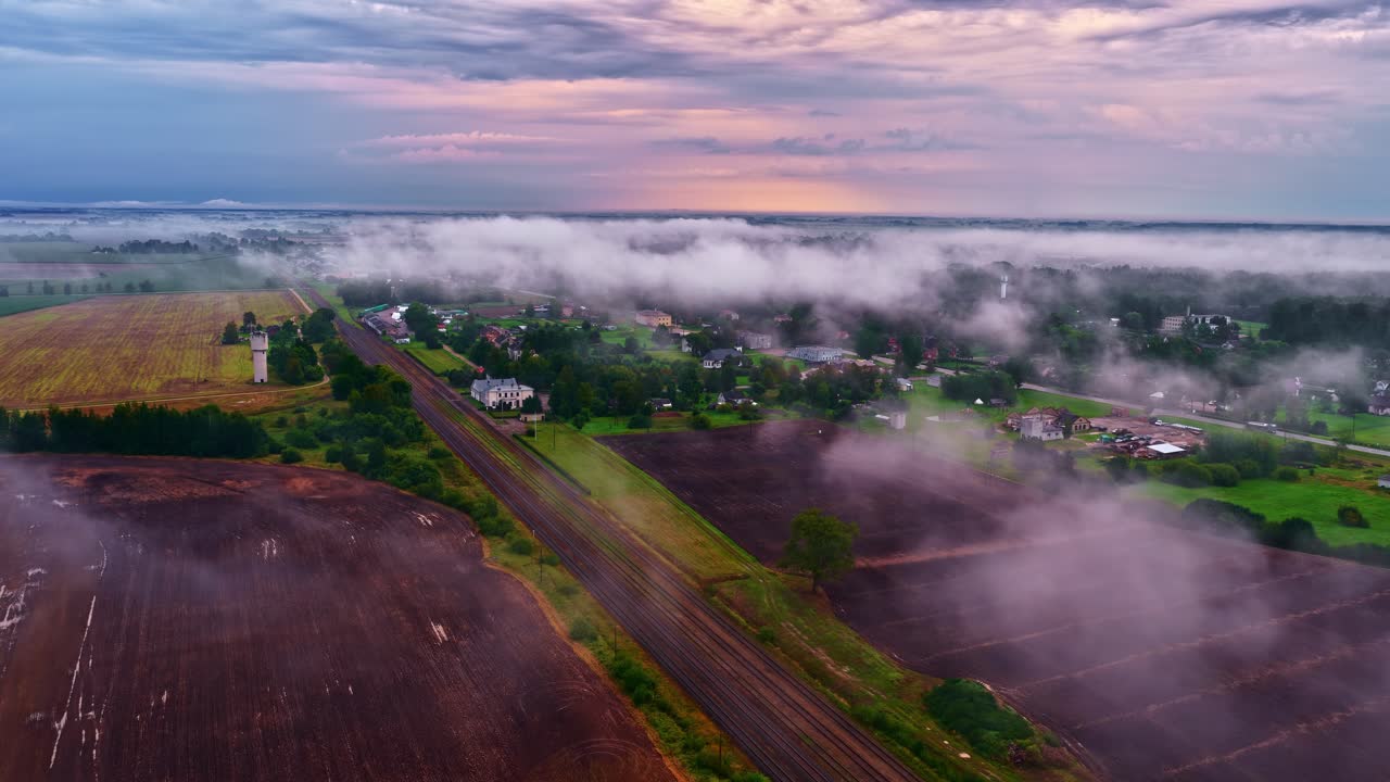 Misty fog above rural countryside agriculture land early morning haze countryside