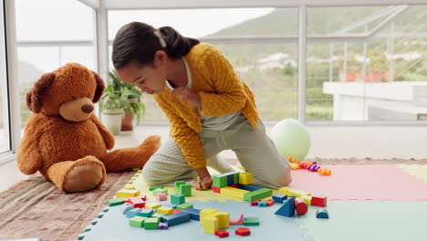 girl child, building blocks and learning on floor