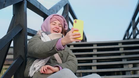 woman taking selfie outdoors