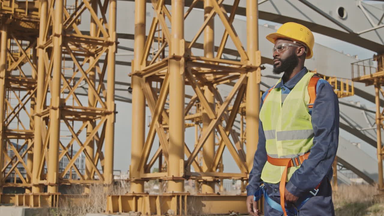 African-American Construction Worker Putting On Hard Hat