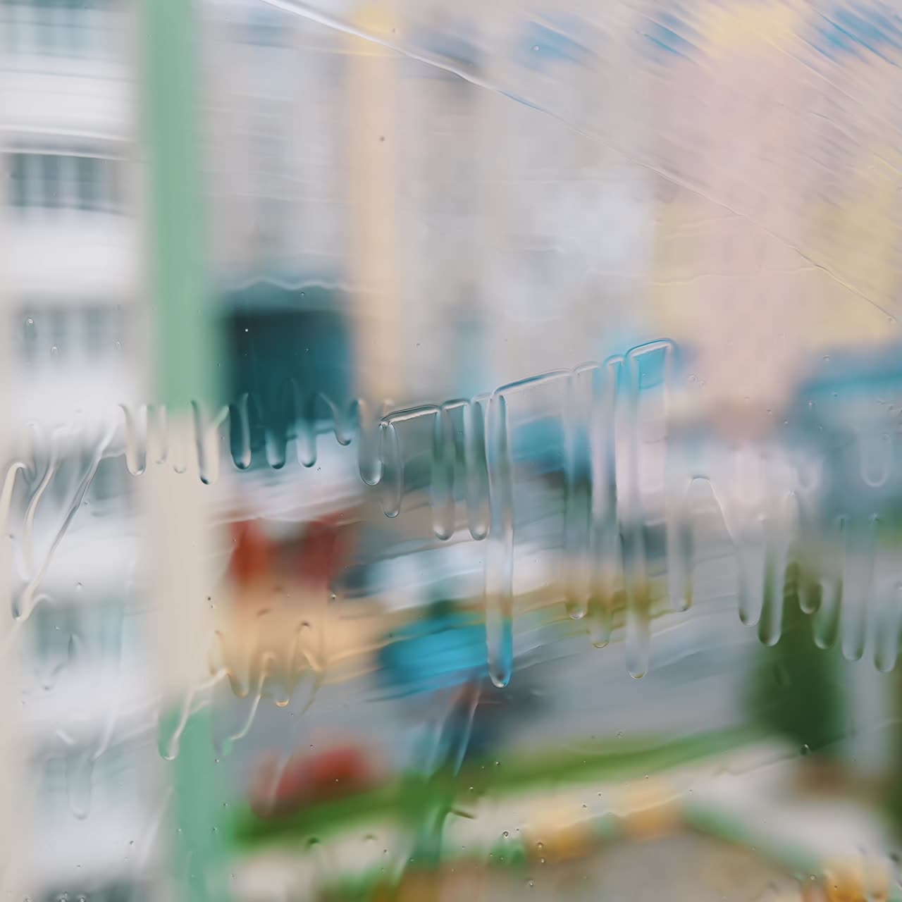 Window cleaning brush washing. Cleaning window with water and special liquid in the city flat. Close-up
