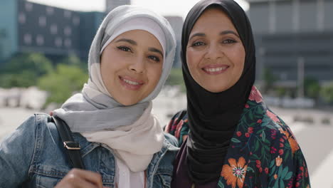 close-up-portrait-of-happy-mother-and-daughter-smiling-cheerful-pose-in-urban-city-wearing-traditional-muslim-hajib-headscarf-enjoying-lifestyle