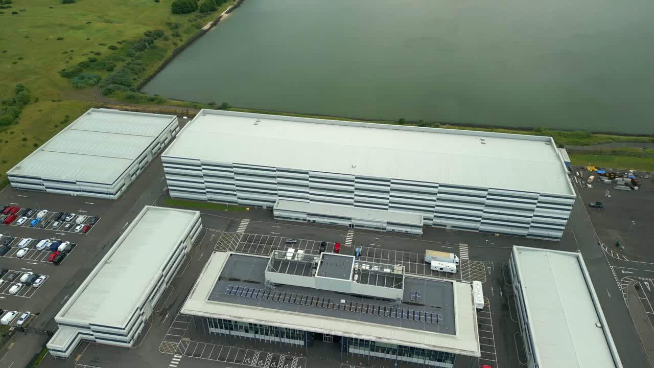 Reversing overhead aerial video GV of Studio Ulster, a virtual production film studio in Belfast, Northern Ireland, UK. Filmed in 60FPS, 4K and with Rec709 color