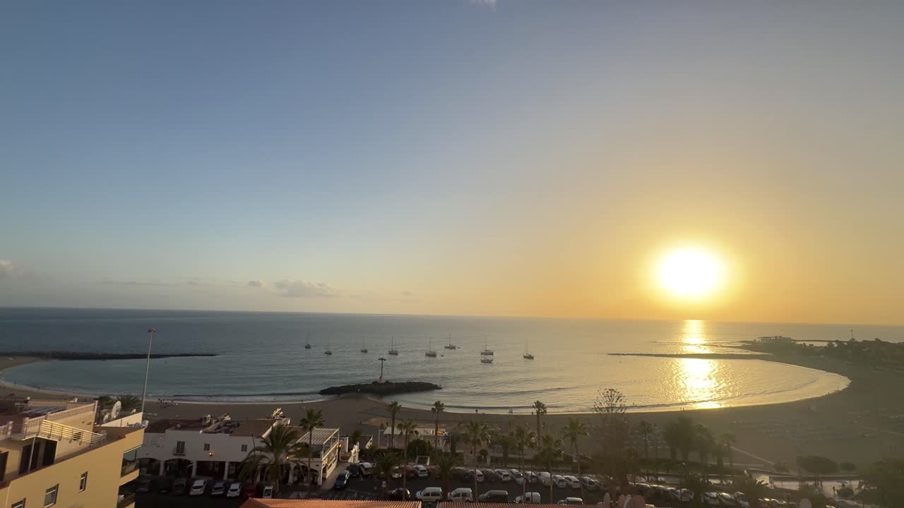Los Cristianos Tenerife sunset sunrise beach sun reflection ocean clear skyline Spain Canary Islands