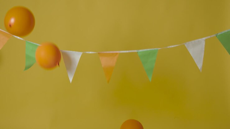 Blue Screen Mobile Phone Against Bunting In Colours Of Irish National Flag Hung In Studio To Celebrate St Patricks Day