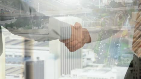 animation of businessman and businesswoman shaking hands over cityscape