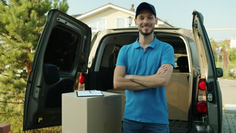 delivery person in front of delivery van