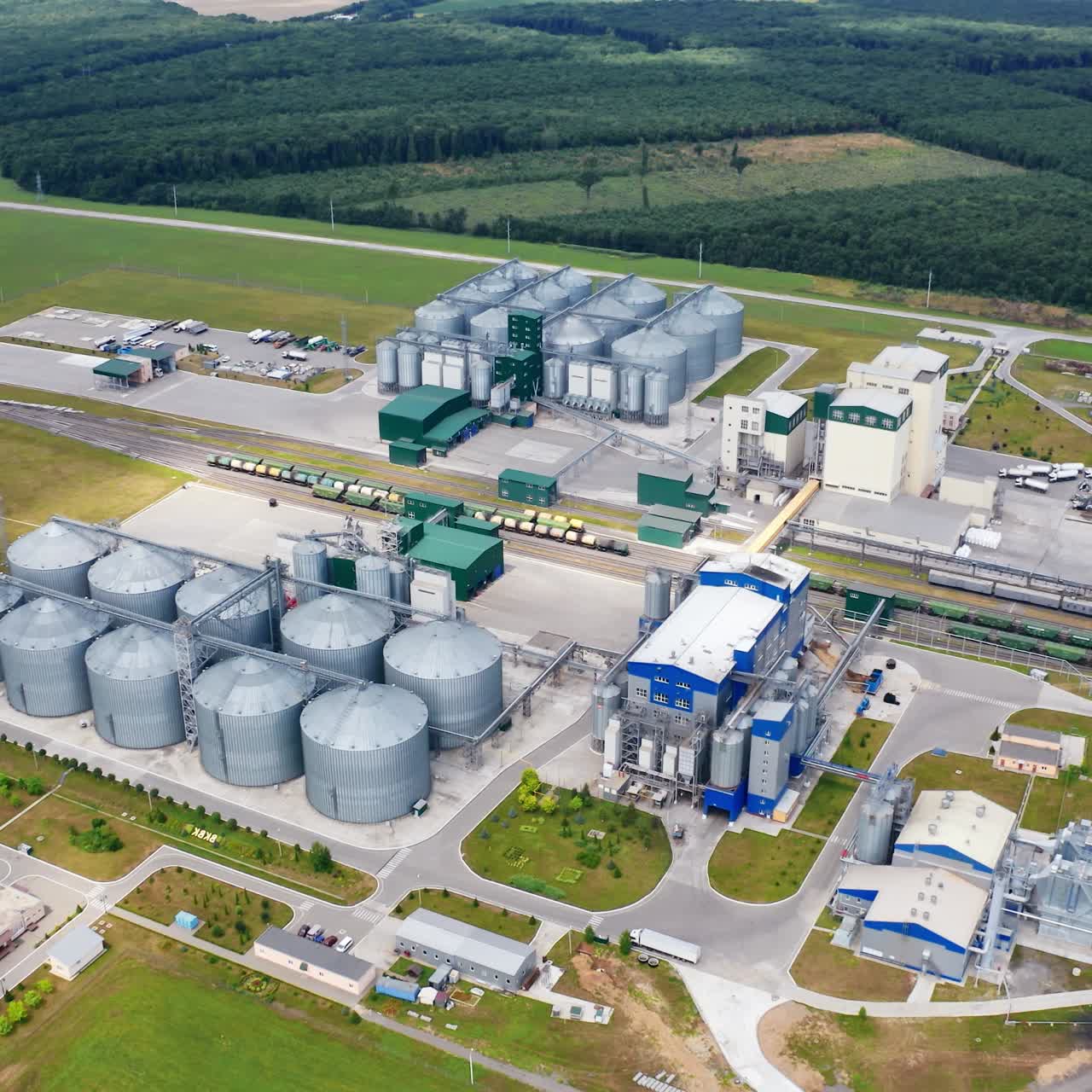 Big factory steel factory storages. Tower industrial metal grain elevator storages