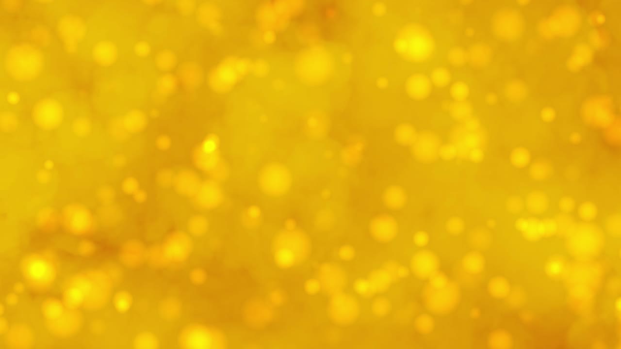 Sfondo astratto con fumo color oro e luci di particelle sfocate.