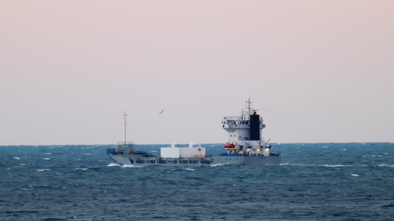 View of a boat moving on the sea in the evening