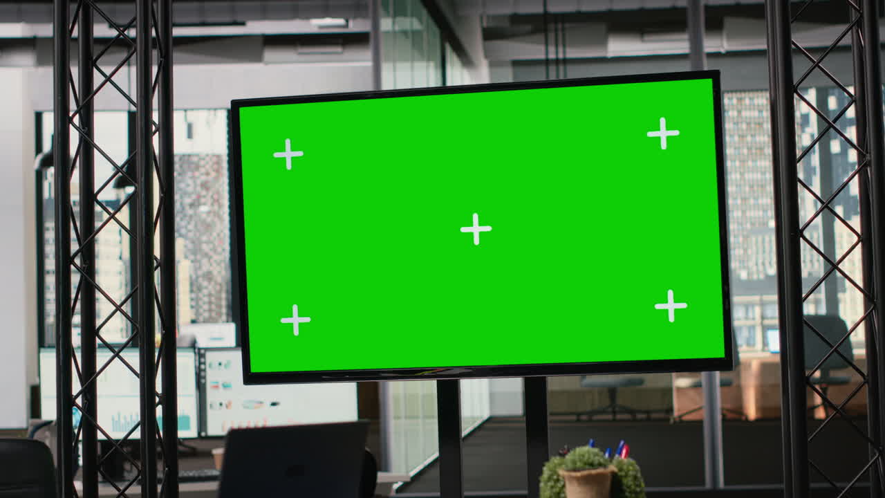 Unoccupied business office with chroma key TV monitor in a multinational company