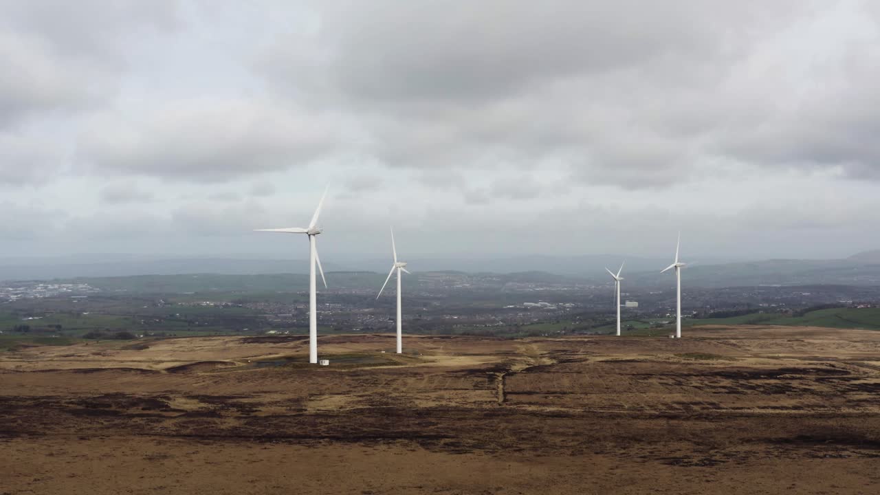 Aerial footage of wind turbines in a field