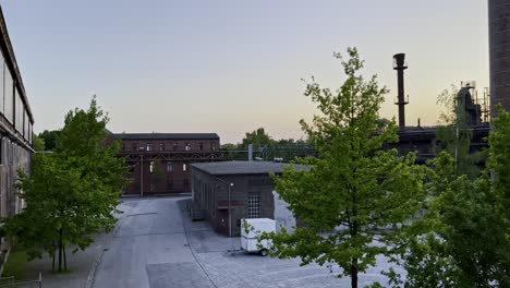 Disused-factory-premises-in-the-Landscape-Park-Duisburg-in-Germany-at-sunset-with-the-old-factory-building-which-is-now-a-youth-hostel