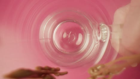 pouring caramel inside a glass in slow motion inside view