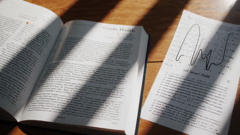 open book with medical notes and chart