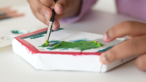 child painting with a brush