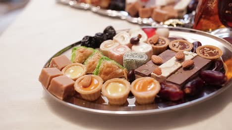 assorted sweet treats on a silver tray