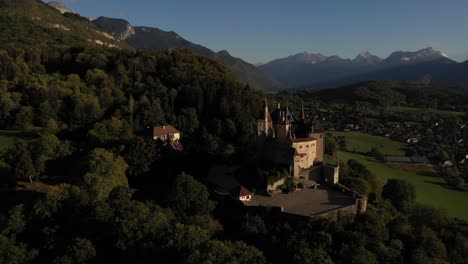 dreamy french castle between mountains and forest in the alps