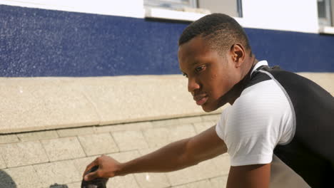 young black man stretching before running outdoors 1