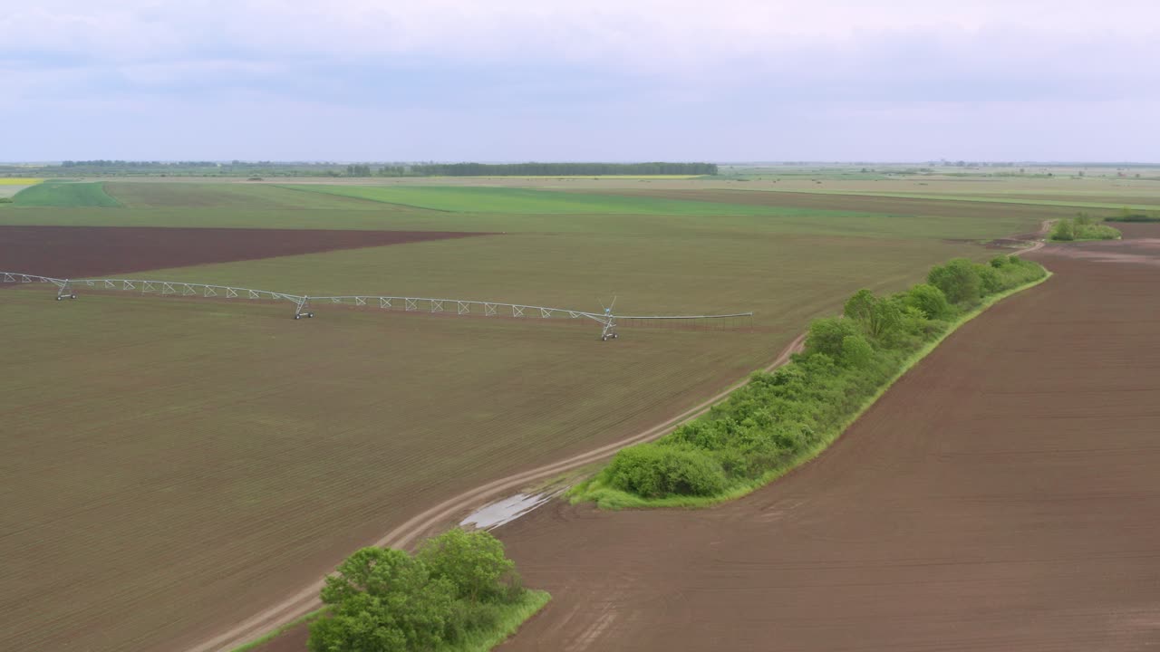 Sprinkler Irrigation - Aerial View Of A Large-scale Pivot Spray Irrigation System On Countryside Field