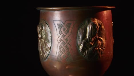 copper bowl for the christian rite. found during excavations. vintage jewelry. religion. close-up