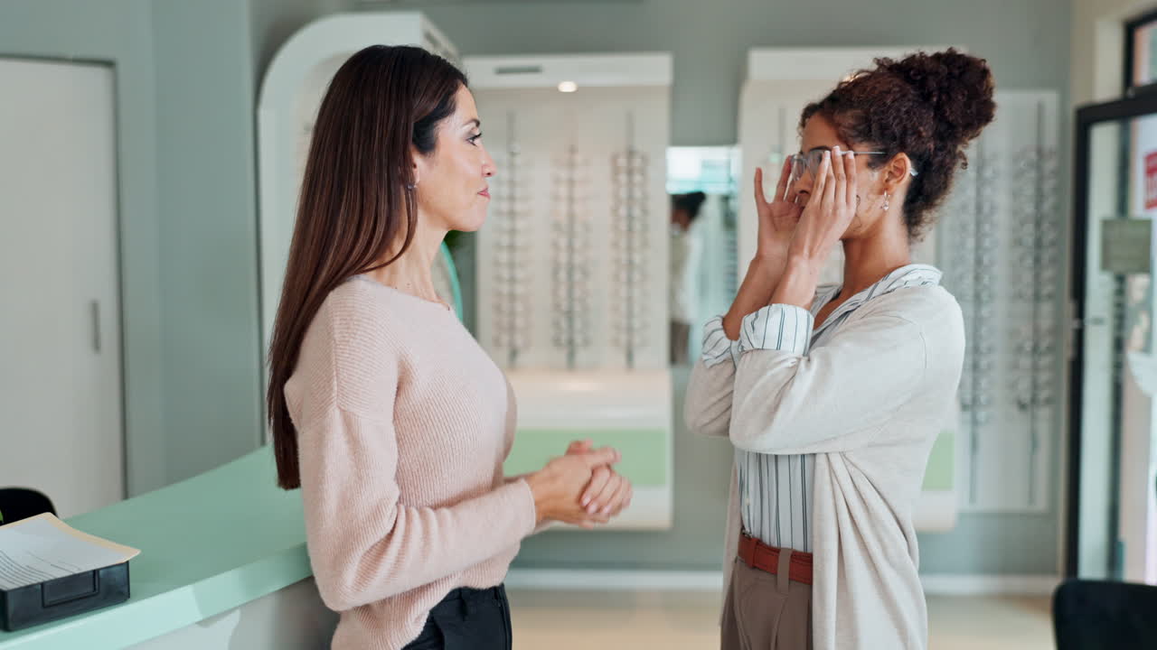 Two women in an optician store