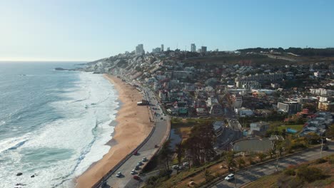 Aerial-view-sunny-Reñaca-scenic-tourist-coastal-hotel-resort-buildings-along-Vina-Del-Mar-seascape