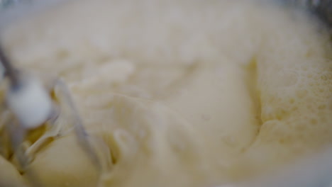 close-up of mixer blades mixing pancake batter