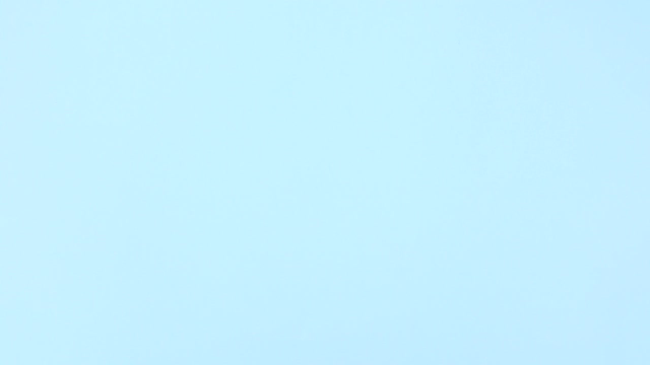 Cookies in blue plate and milk in pink cup appear on blue theme. Stop motion