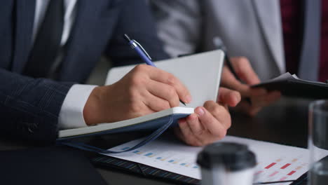 businessman hands writing on a paperwor