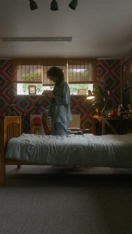 woman using phone in a bedroom