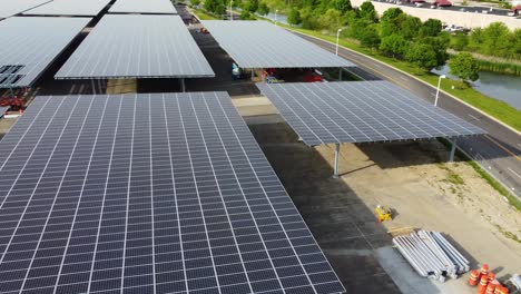 Solar-panels-installed-in-a-corporate-office-complex-parking-lot-and-solar-panels-on-the-office-complex-buildings