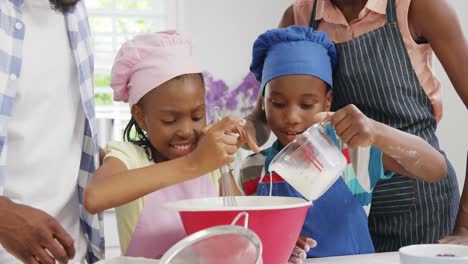 Happy-family-preparing-food-in-kitchen-